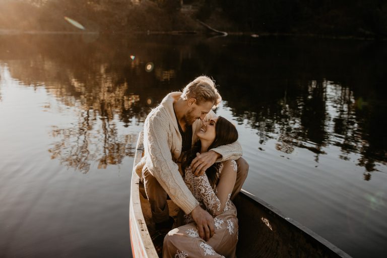 Couple cuddling in a canoe
